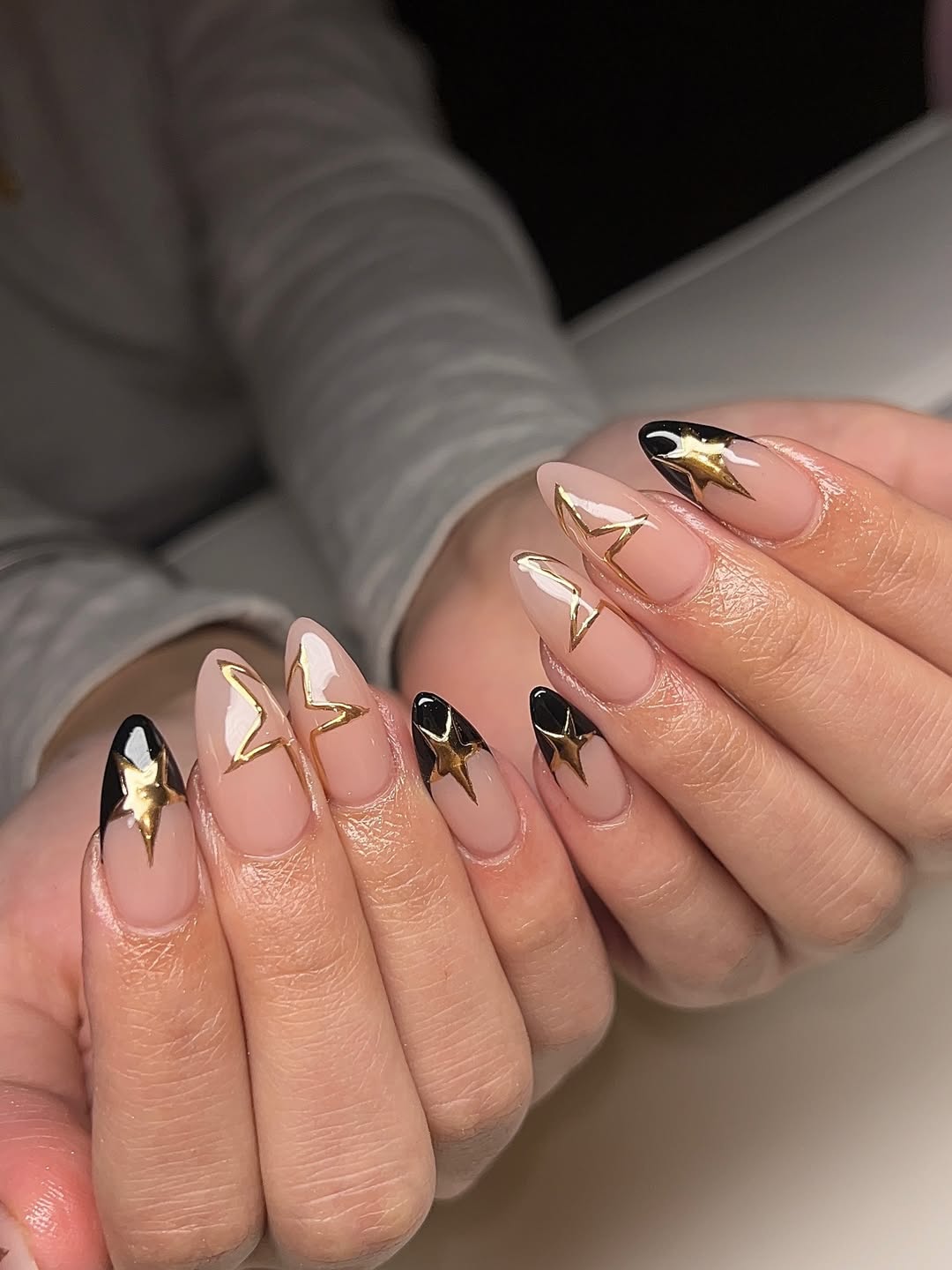 Almond Nails with Gold Star Outlines