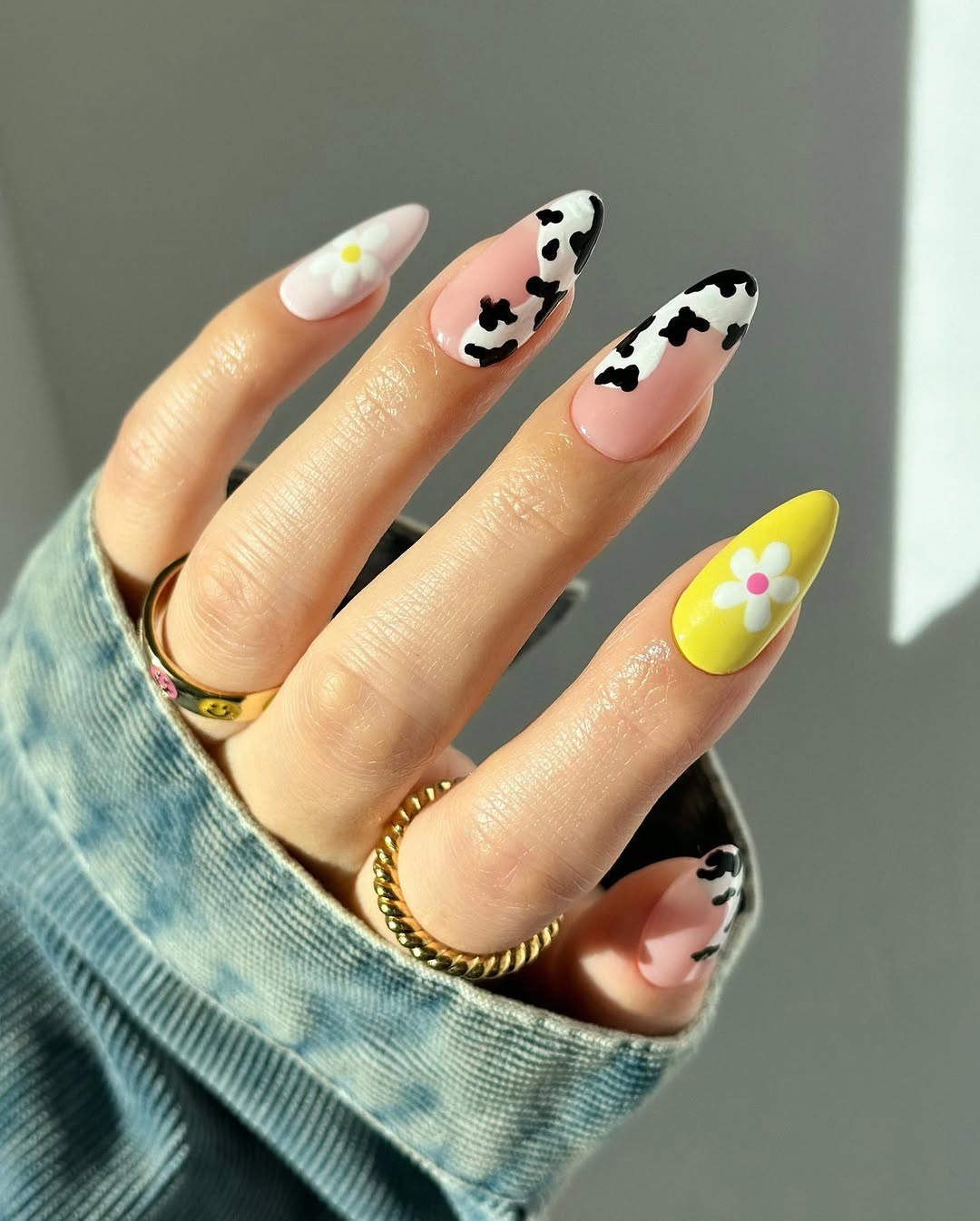 Cow Print and Daisy Nail Design