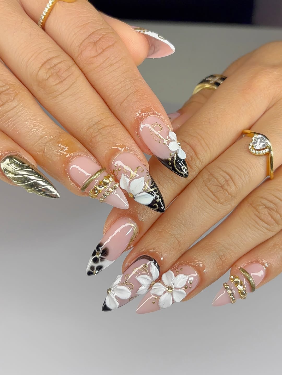 Detailed 3D Floral and Textured Gold Nails