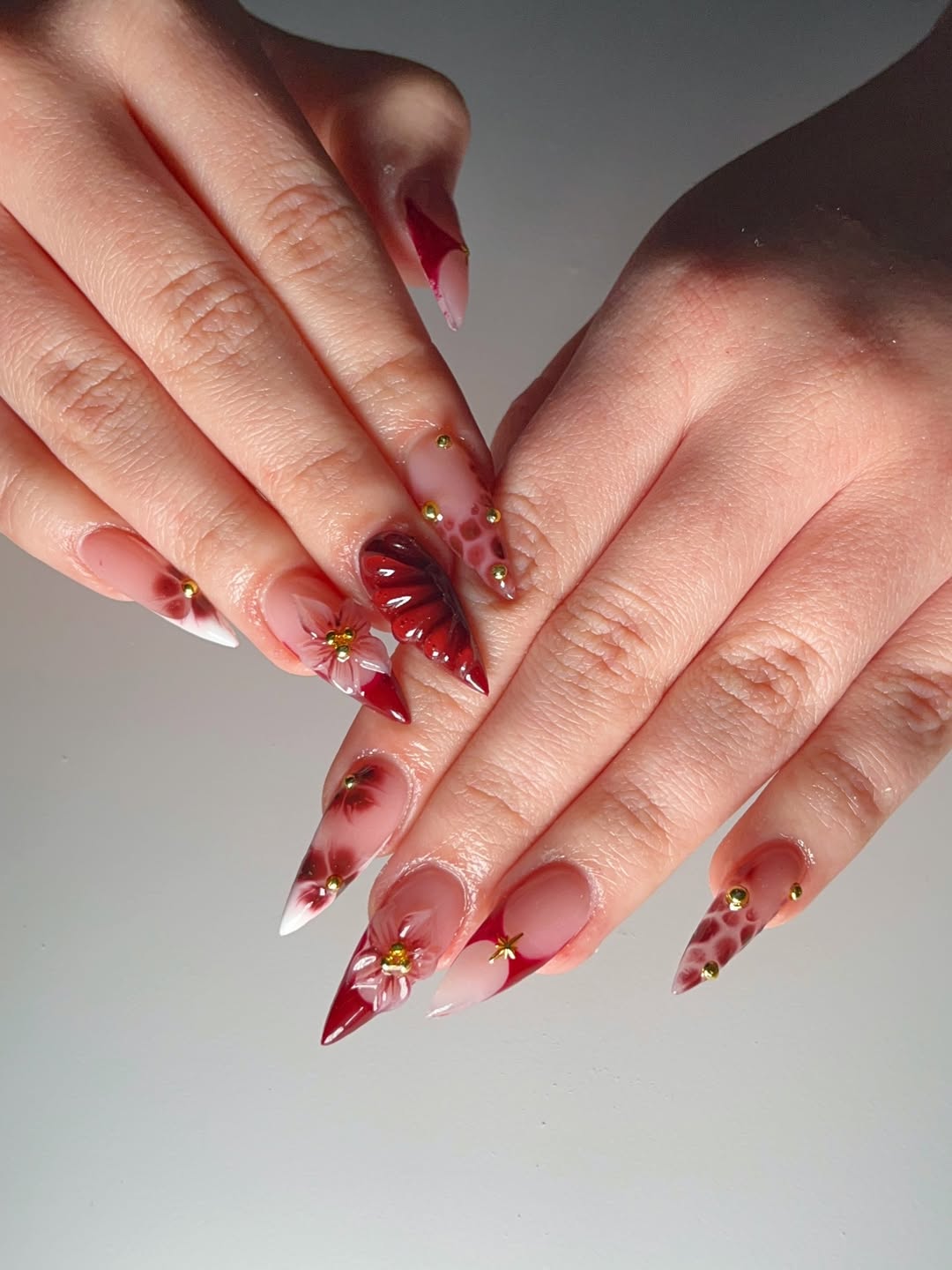 Elaborate Stiletto Art with Ruby Textures