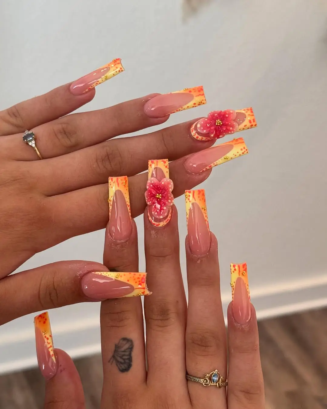 Long Yellow And Orange Speckled Floral Nails