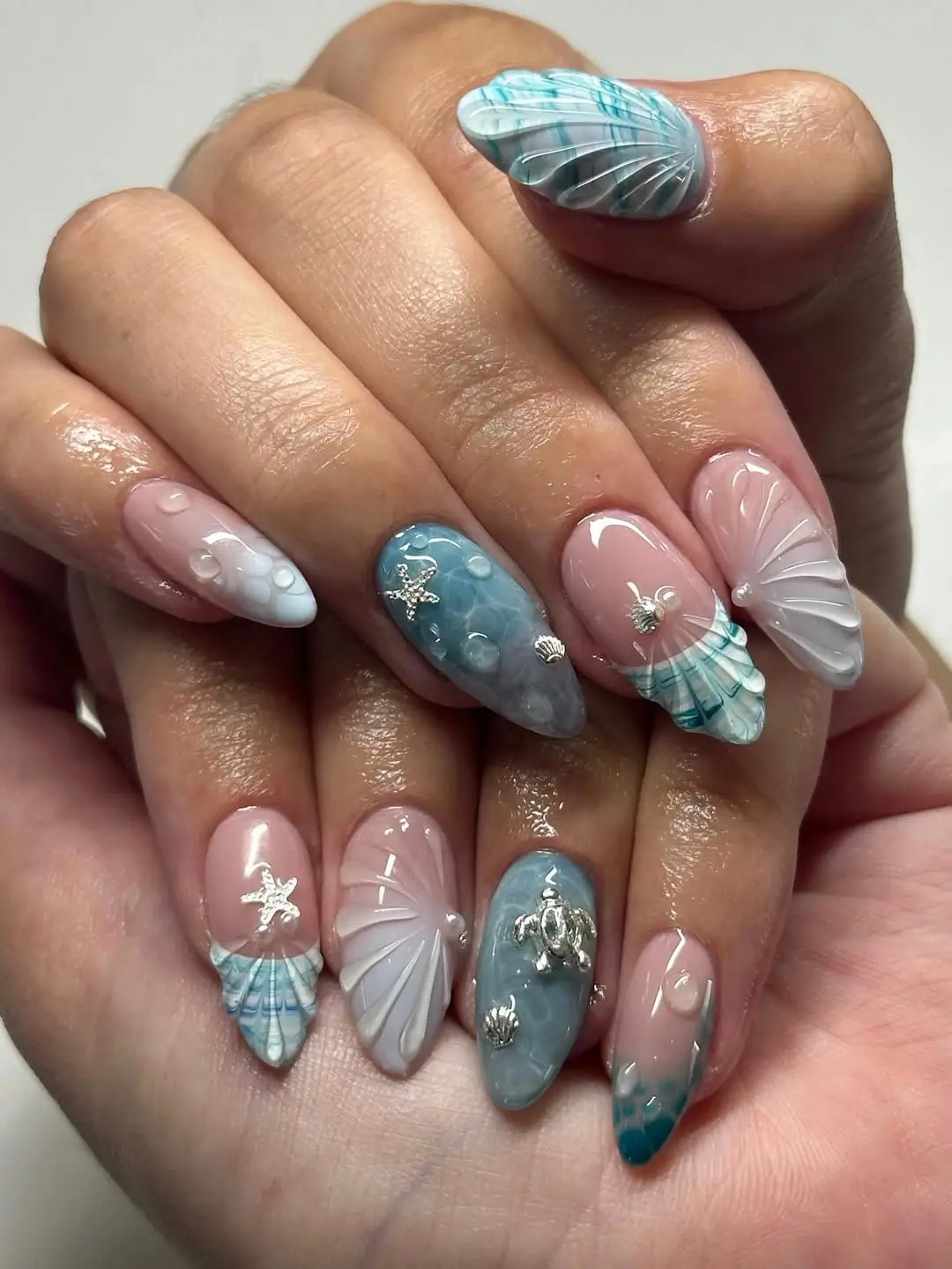 Ocean Water Droplets And Silver Charms