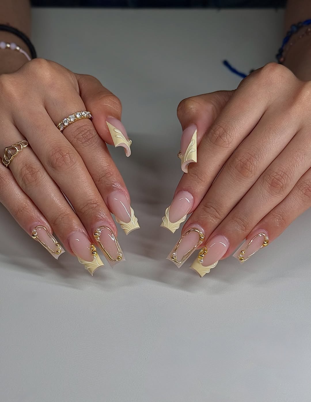 Pale Yellow Textured French and Gold Square Nails