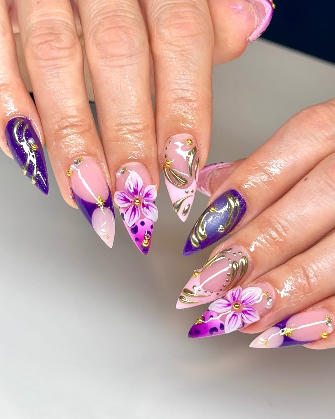 Sharp Stiletto Purple and Gold Floral Nails