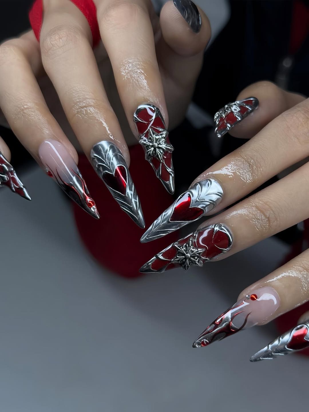 Silver Chrome and Red Stiletto Nails